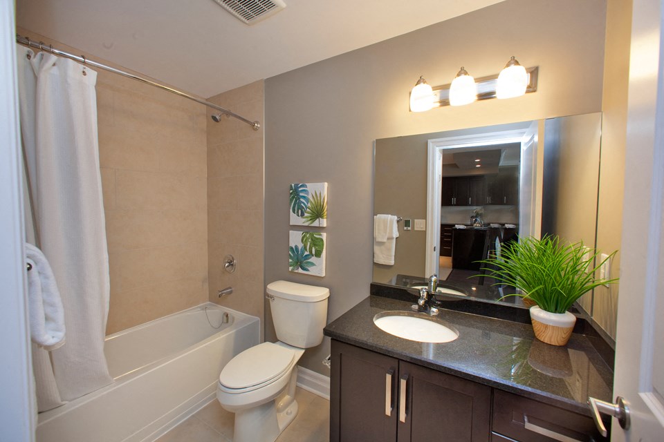 Juliana Place Apartments bathroom featuring tub shower in Woodstock, ON