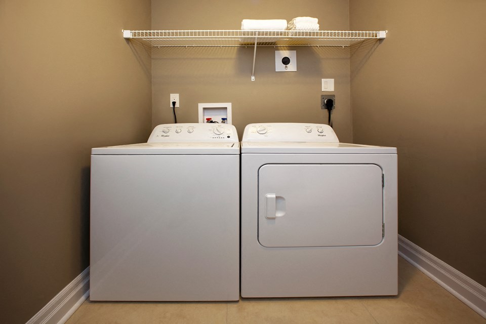 Juliana Place Apartments in-suite laundry featuring washer and dryer in Woodstock, ON