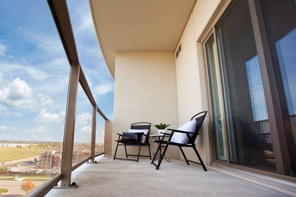 Juliana Place Apartments balcony featuring glass barrier in Woodstock, ON