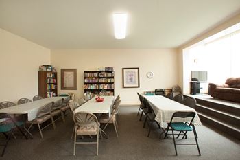 social room tables, chairs and sofa at Pembridge Square Apartments in Kingston ON