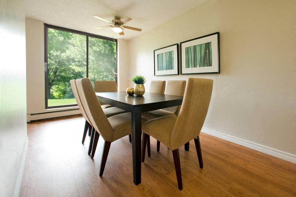 Squire Court large dining area with hard surface flooring and access to balcony in St. Catharines, ON