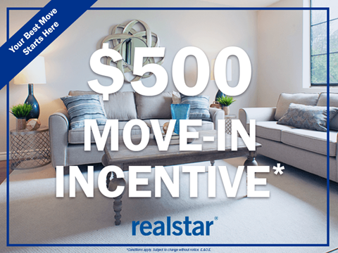 a living room with a couch and a chair and a 500 move in incentive