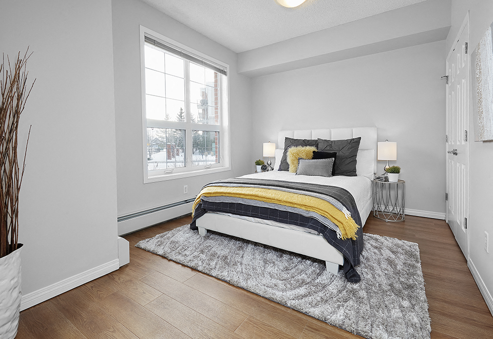 Wellington Court large bedroom with hardwood flooring in Edmonton, AB