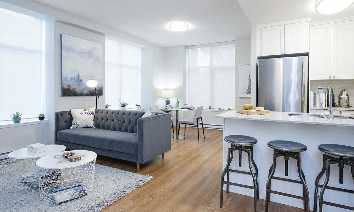 Two bedroom townhouse open concept living space and kitchen at Wesley Place apartments in Vancouver, British Columbia