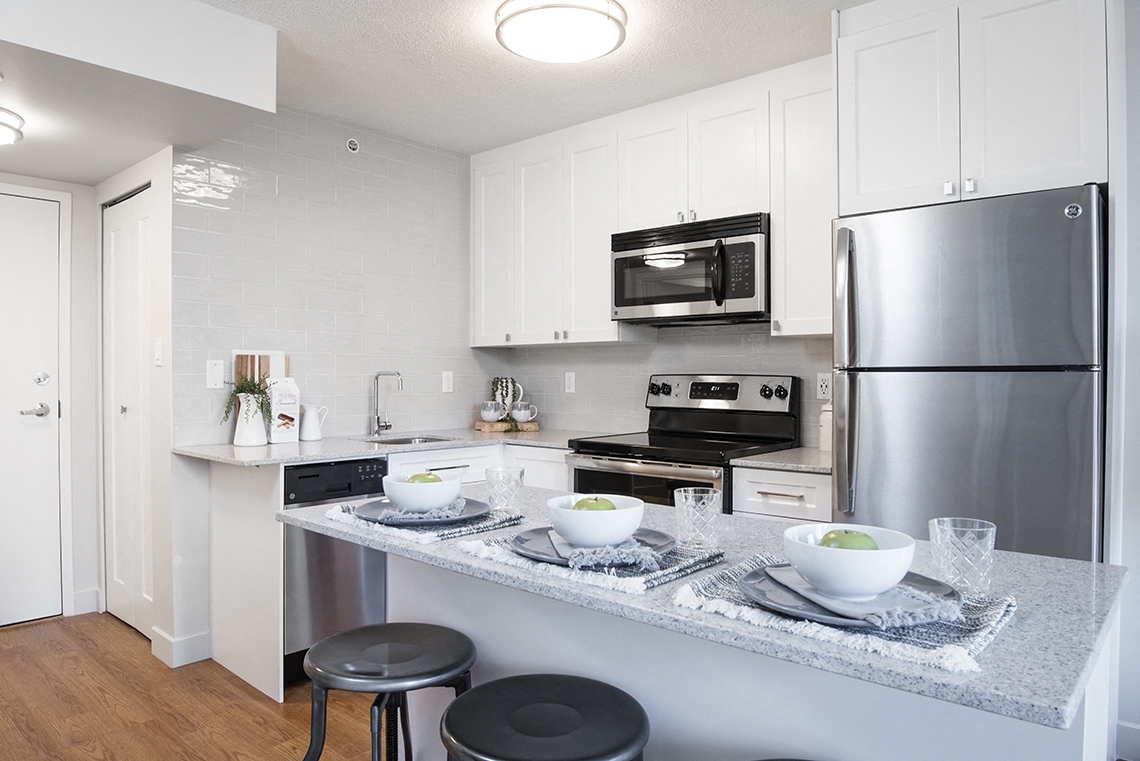 Wesley Place in Vancouver, BC Modern kitchen with stainless steel appliances