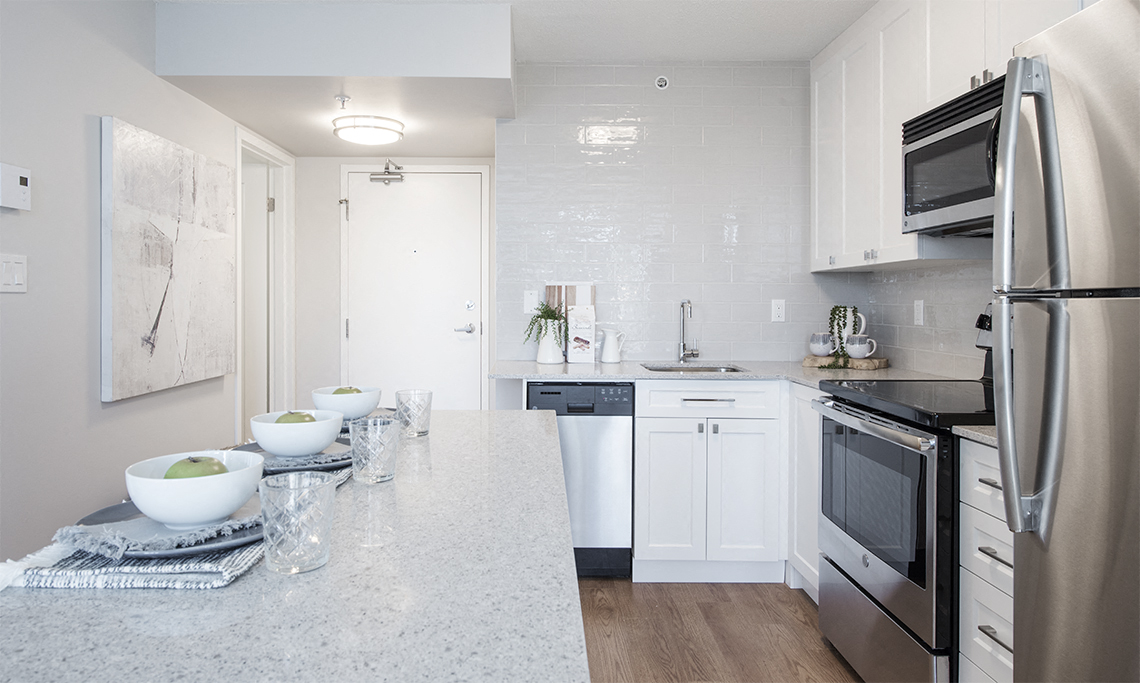 Wesley Place in Vancouver, BC Bright and airy kitchen with floating island