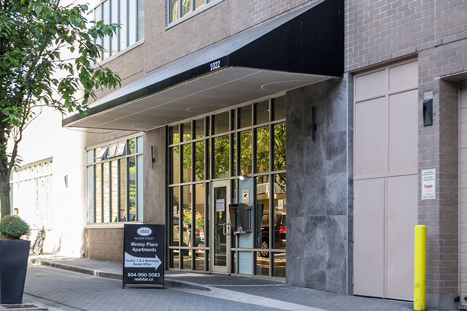 Wesley Place in Vancouver, BC Entrance to building with awning