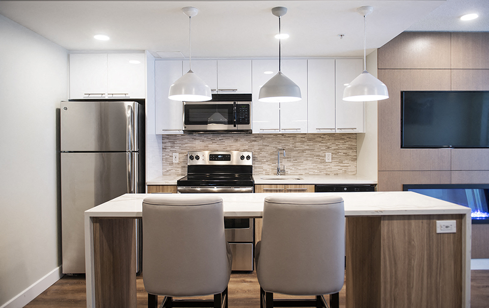 Wesley Place in Vancouver, BC Social room kitchen with upgraded island bar