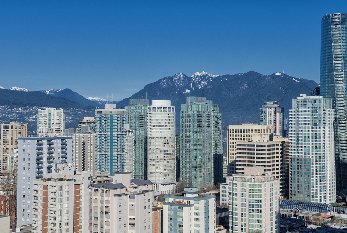 High rises with view of the mountains in Vancouver, British Columbia