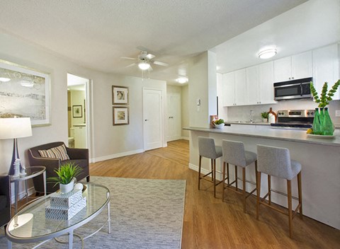 Whitby Place in Whitby, ON well lit living room and kitchen