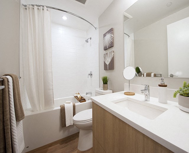 Yello On Yates modern bathroom with full size bathtub in Vancouver, BC