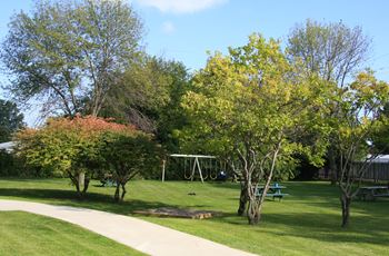 Leamington Heights in Leamington, ON well-maintained grounds with picnic tables and playground