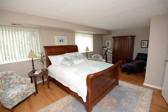 Dalhousie Place large bedroom with vinyl plank flooring in Amherstburg, ON