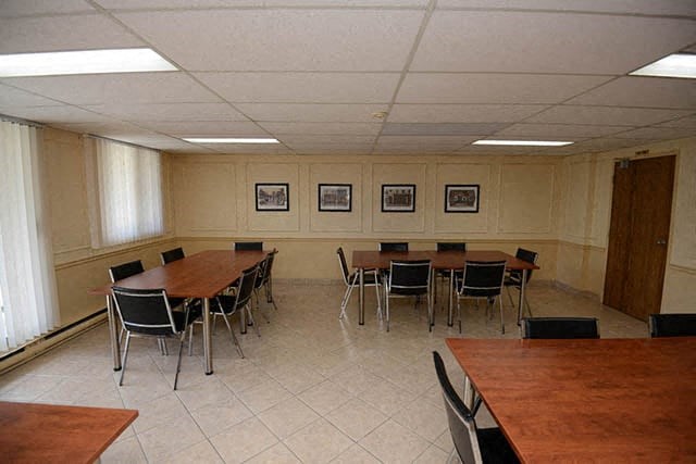 Pickering Towers social room with tables and chairs in Amherstburg, ON