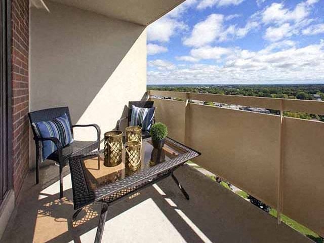 Highpoint Barrie Balcony view over bright blue skies and lush greenery in Barrie, ON
