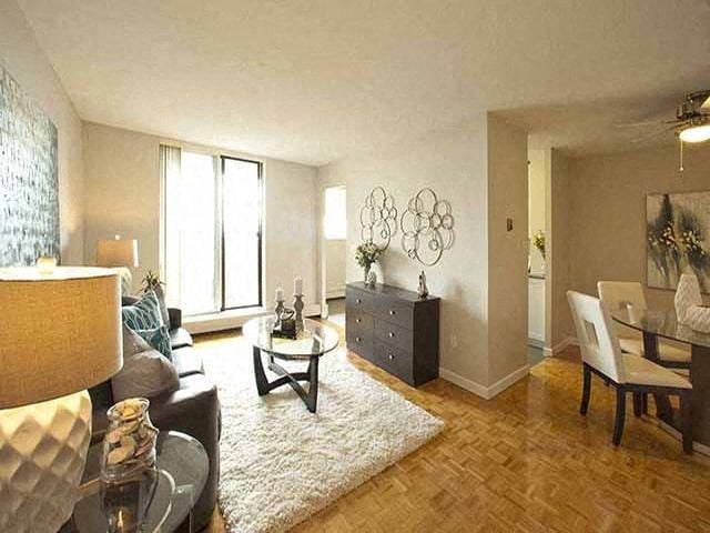 Highpoint Barrie Living room facing the balcony with view of the dining room on the right in Barrie, ON