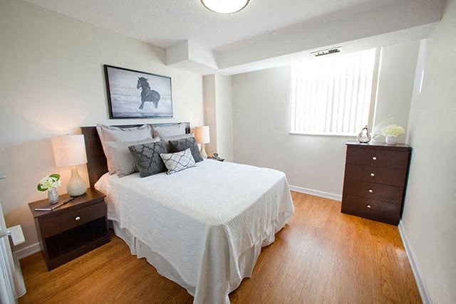 Edgehill Apartments in Barrie, ON Bedroom with a neatly made bed