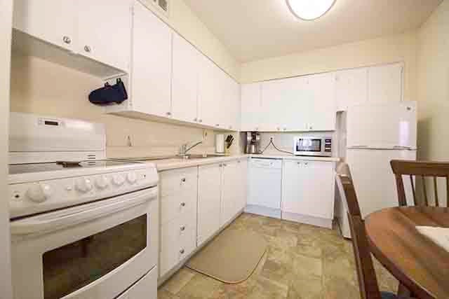 Prince William Apartments kitchen with white cabinetry in Bellville, ON