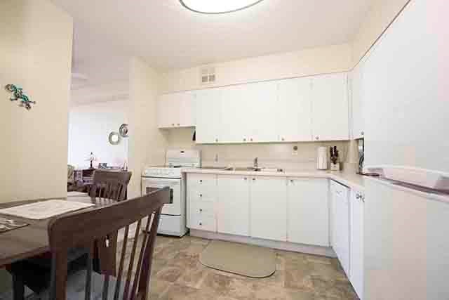 Prince William Apartments kitchen with dining area in Bellville, ON