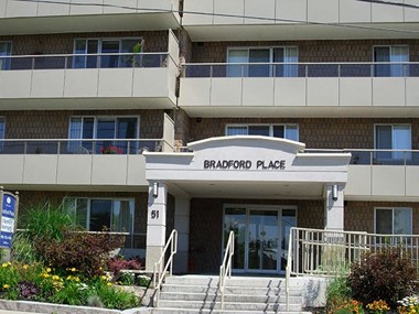 Exterior of Bradford Place surrounded by flowers and plant life