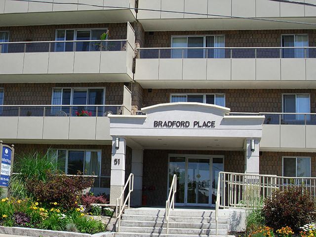 Exterior of Bradford Place surrounded by flowers and plant life - Photo Gallery 1