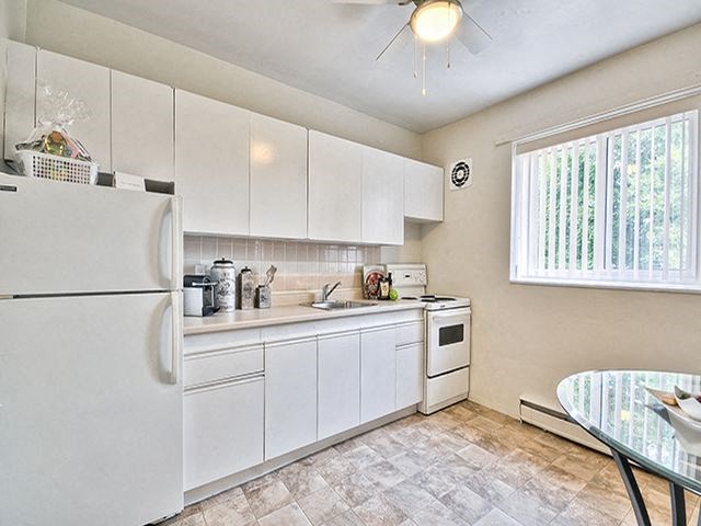 Brockville Apartments in Brockville, ON kitchen with fridge and stove