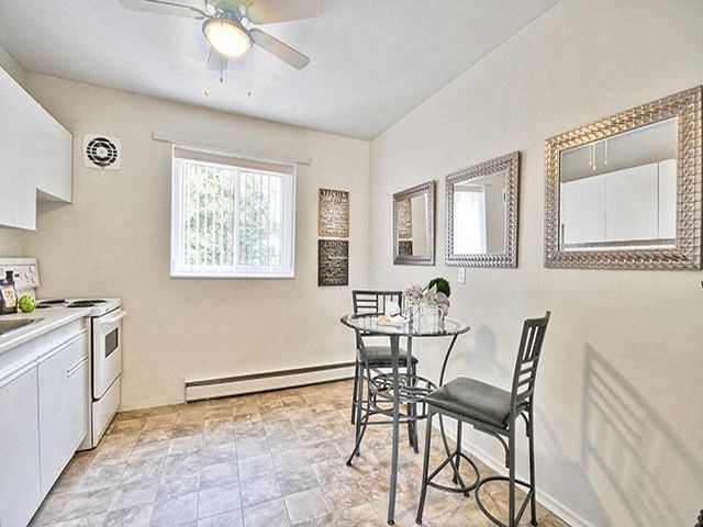 Brockville Apartments in Brockville, ON kitchen with dining table and chairs