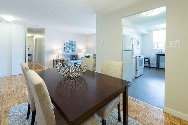Cedarwoods Towers dining room with view into kitchen and living room in Kitchener, ON