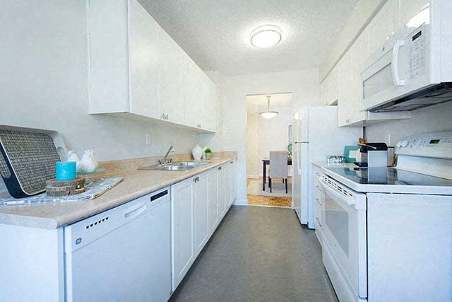 Cedarwoods Tower kicthen with dishwasher, full range stove, microwave, and full size fridge in Kitchener, ON
