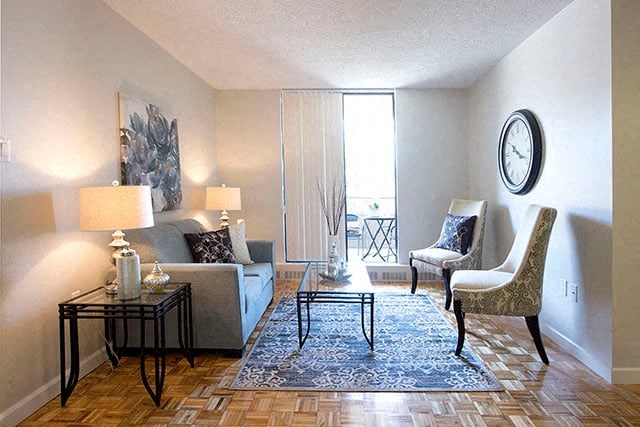 Cedarwoods Tower living room with access to balcony in Kitchener, ON