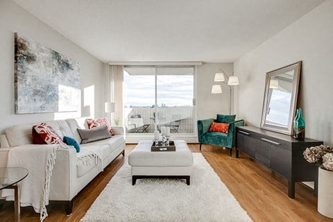 a living room with a white couch and a table