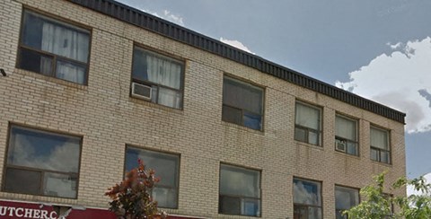 A brick building with a sign that says Butcher's.