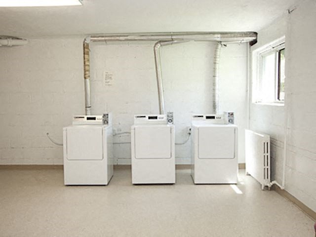 Berry Road in Etobicoke, ON  Large amenity space with washer, dryer, sunlit