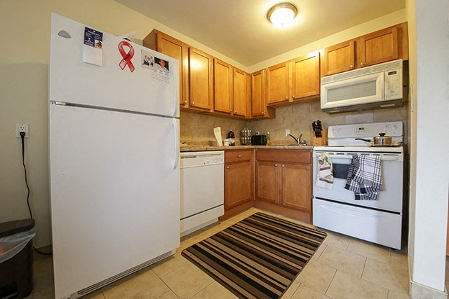 Garden Court kitchen with fridge, stove and dishwasher in Windsor, ON