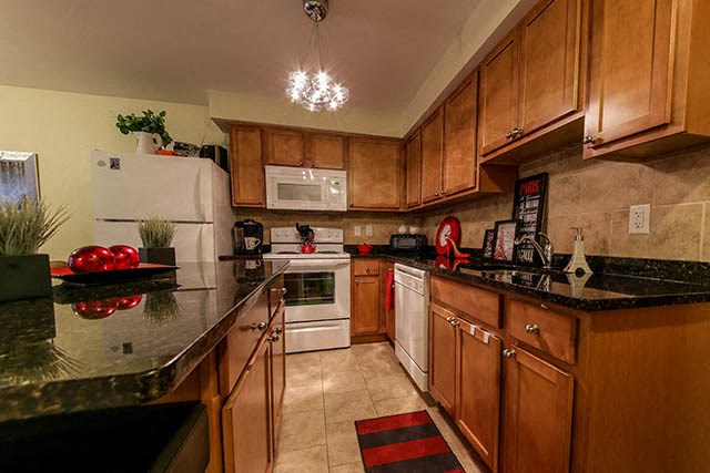 Garden Court in Windsor, ON kitchen with fridge, stove and dishwasher