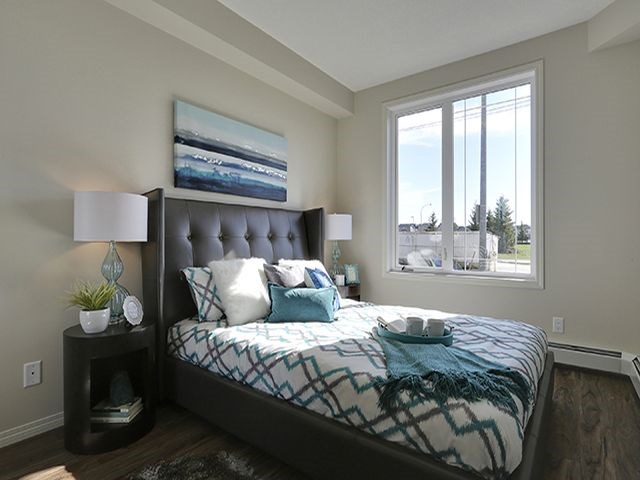 Airdrie Place in Airdrie, AB Contemporary style bedroom with large window
