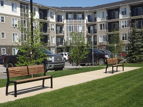 Enjoy modern architecture and ample parking Airdrie Place in Airdrie, AB Building exterior highlighting modern design and parking lot