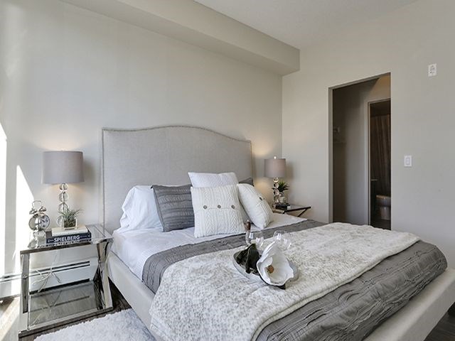 Airdrie Place in Airdrie, AB Elegant bedroom with walk-in closet and bathroom