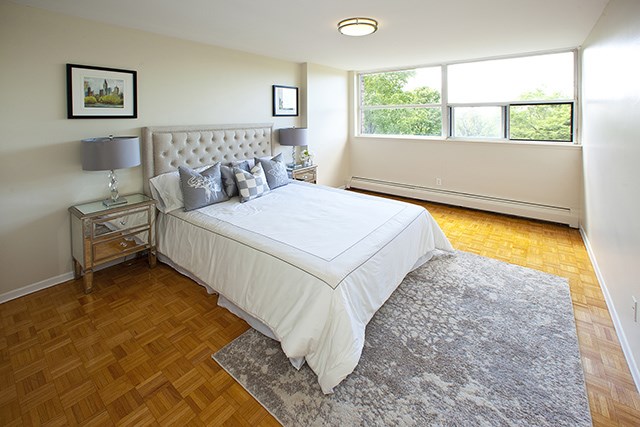 Brookbanks Apartments large, contemporary bedroom with lots of natural light in Toronto, ON