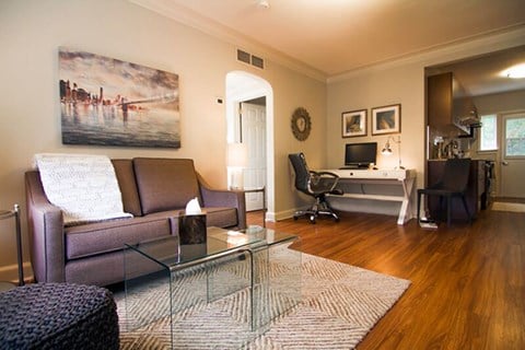 Kelvin Apartments living room with laminate wood flooring in Toronto, ON