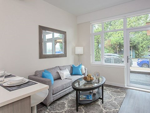 a living room with a couch and a table