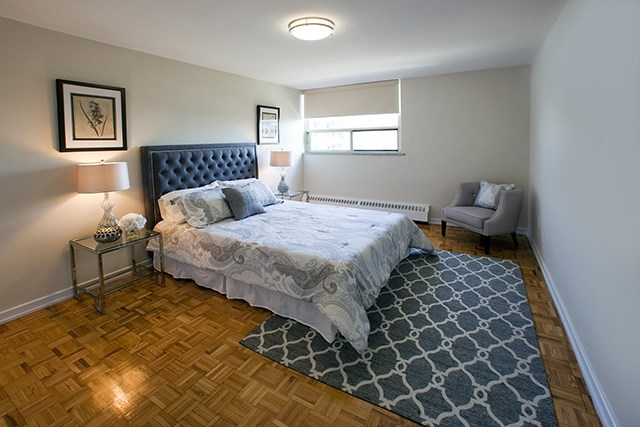 Rockford Apartments large bedroom with wood flooring in Toronto, ON
