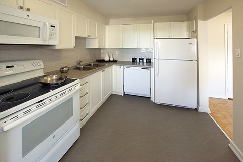 a kitchen with a stove and a refrigerator