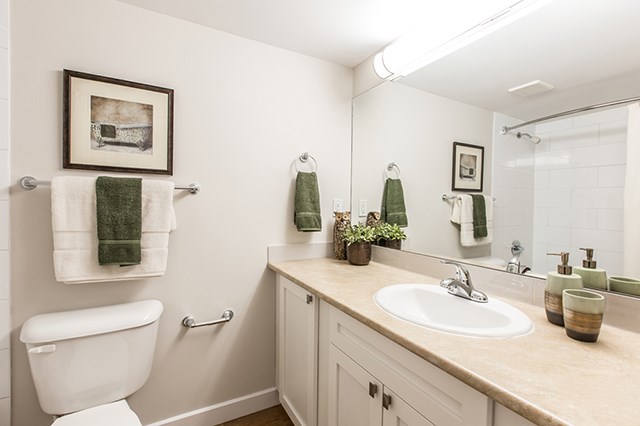 Secord House in Edmonton, AB bathroom with large mirror