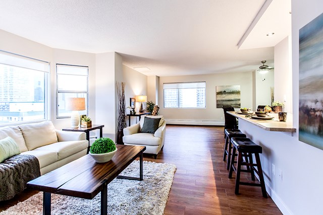 Secord House in Edmonton, AB kitchen with breakfast bar opened to living room