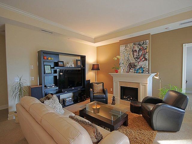 The Conservatory large, cozy living room with fireplace in Kelowna, BC