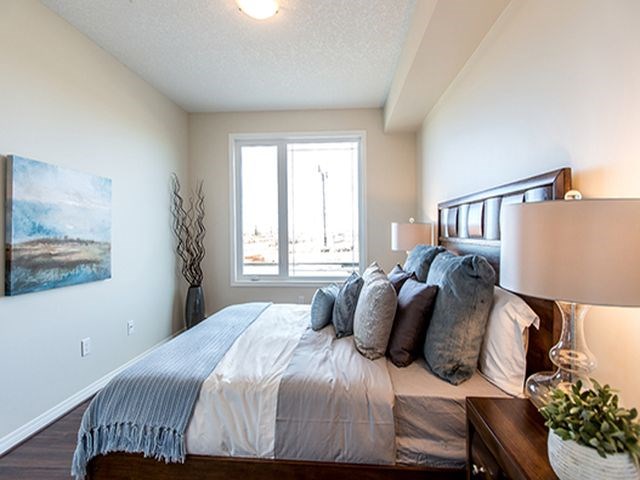Giroux Estates in St. Albert, AB well lit bedroom