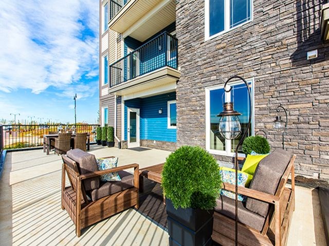 Giroux Estates in St. Albert, AB outdoor patio with lounge chairs and tables