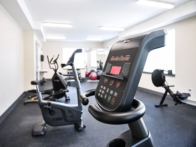 a gym with an exercise bike and other fitness equipment