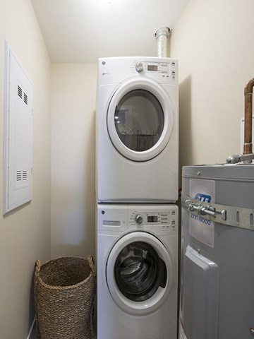 a washing machine and a dryer in a laundry room